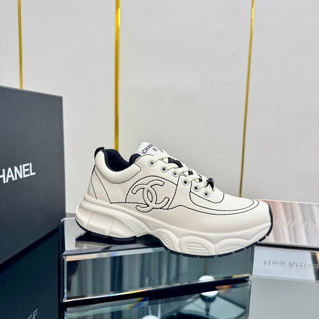 Chanel Trainers Sneaker in White Calfskin with Black Embroidered