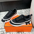 Hermes Bouncing Sneaker in Black Mix White Calfskin and Fabric
