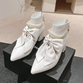 Chanel Short Boots in White Sheepskin with Bow
