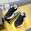 Chanel Sneaker in Black with White Logo Calfskin and Mesh